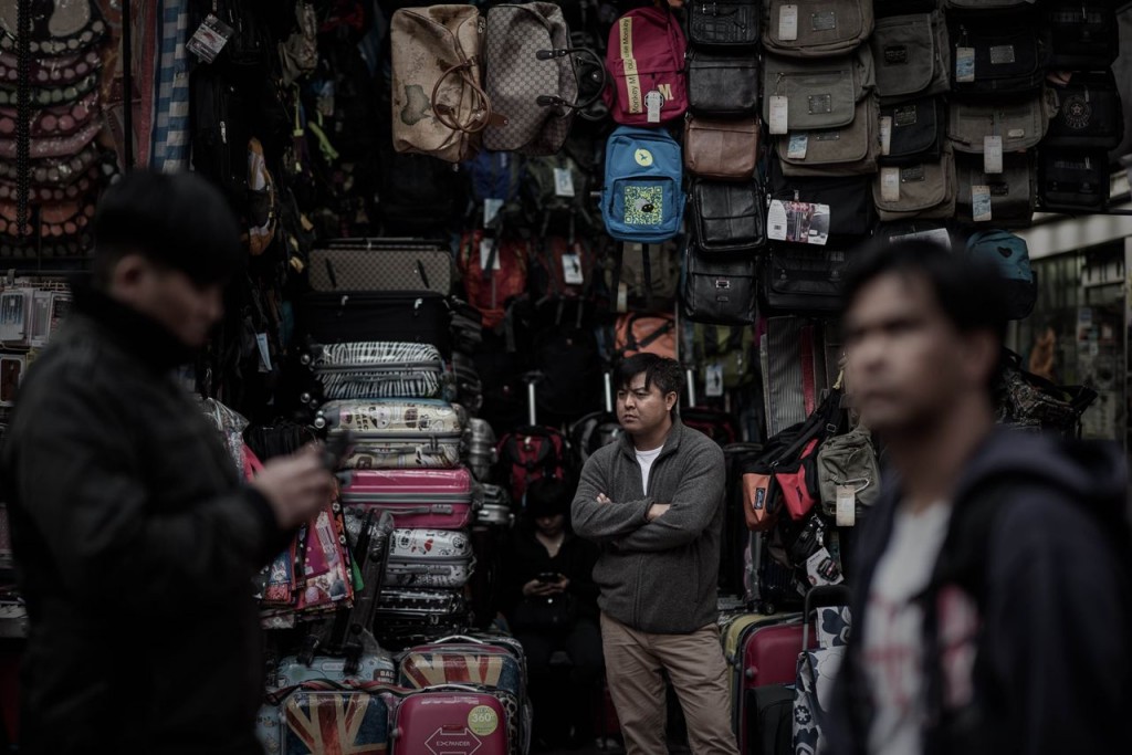 Man outside his shop